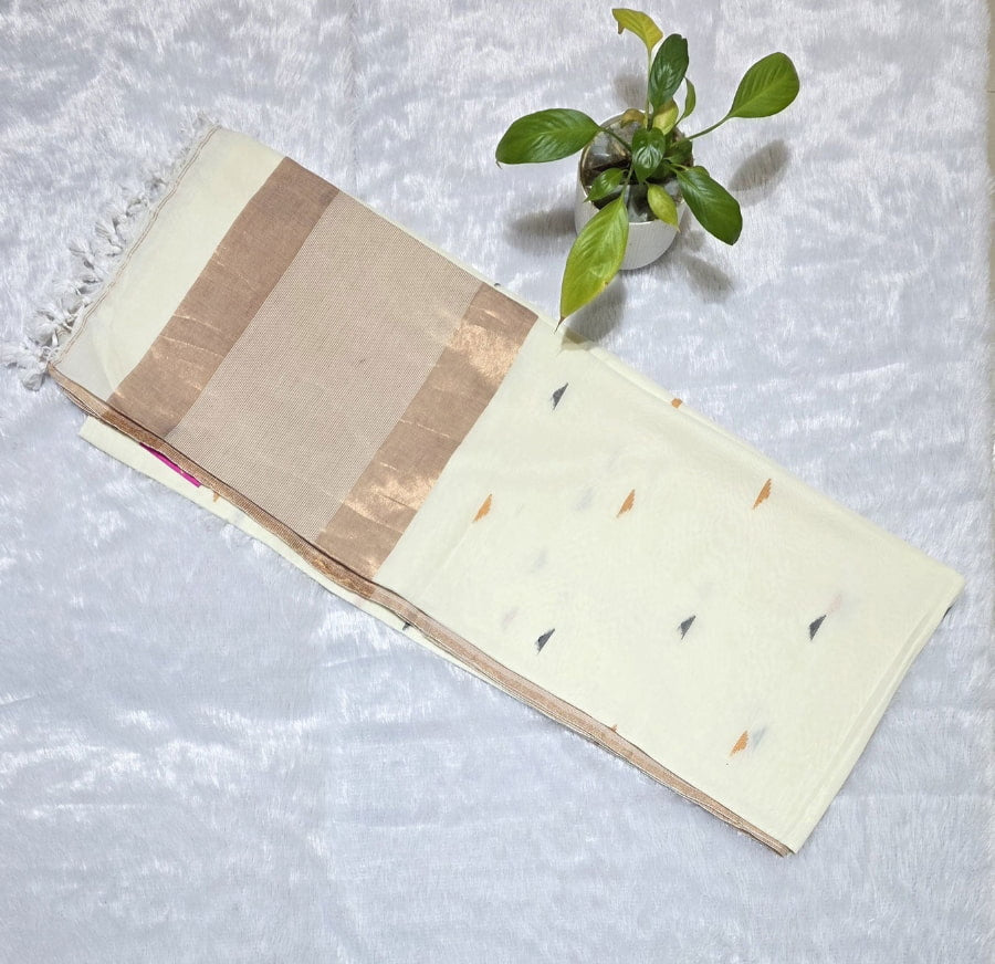 White pure cotton saree featuring colourful triangle butti weaving, copper zari pallu and minimal golden border with tassels