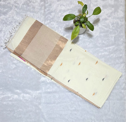White pure cotton saree featuring colourful triangle butti weaving, copper zari pallu and minimal golden border with tassels