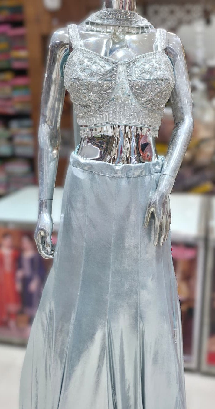 Full view of ice blue metallic lehenga with embroidered blouse