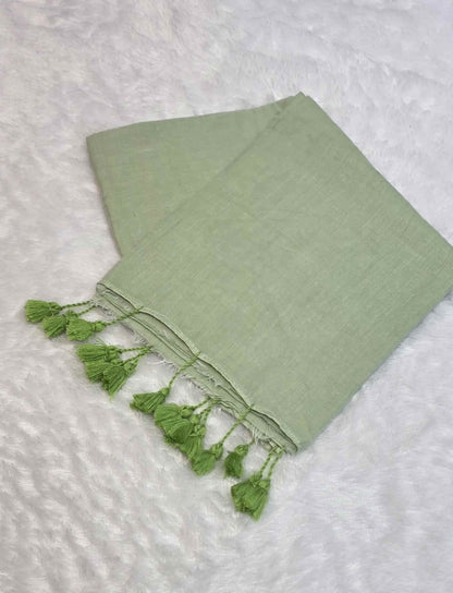 Lightweight light green mulmul cotton saree with handcrafted tassels
