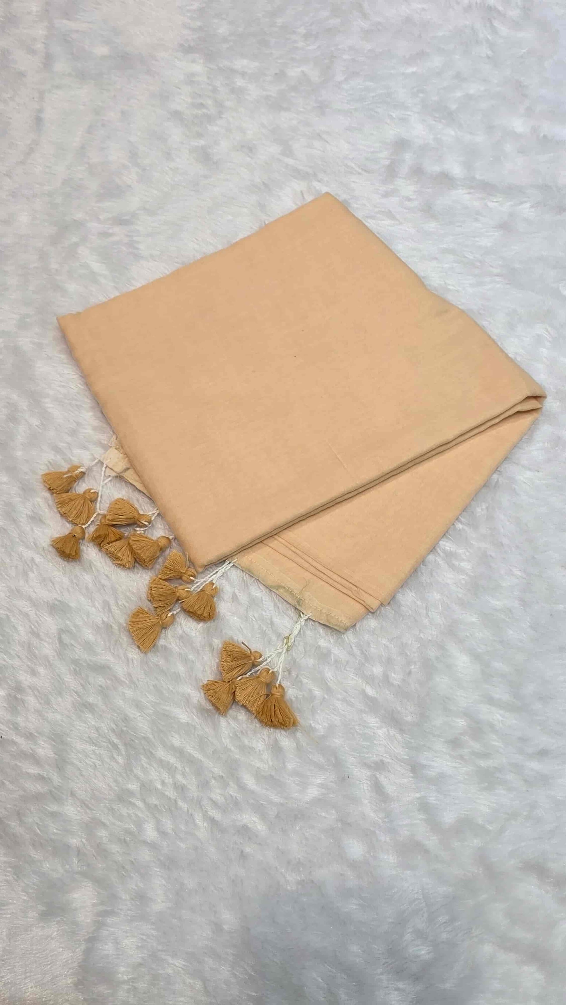 Soft mulmul cotton saree in cream with handcrafted tassels