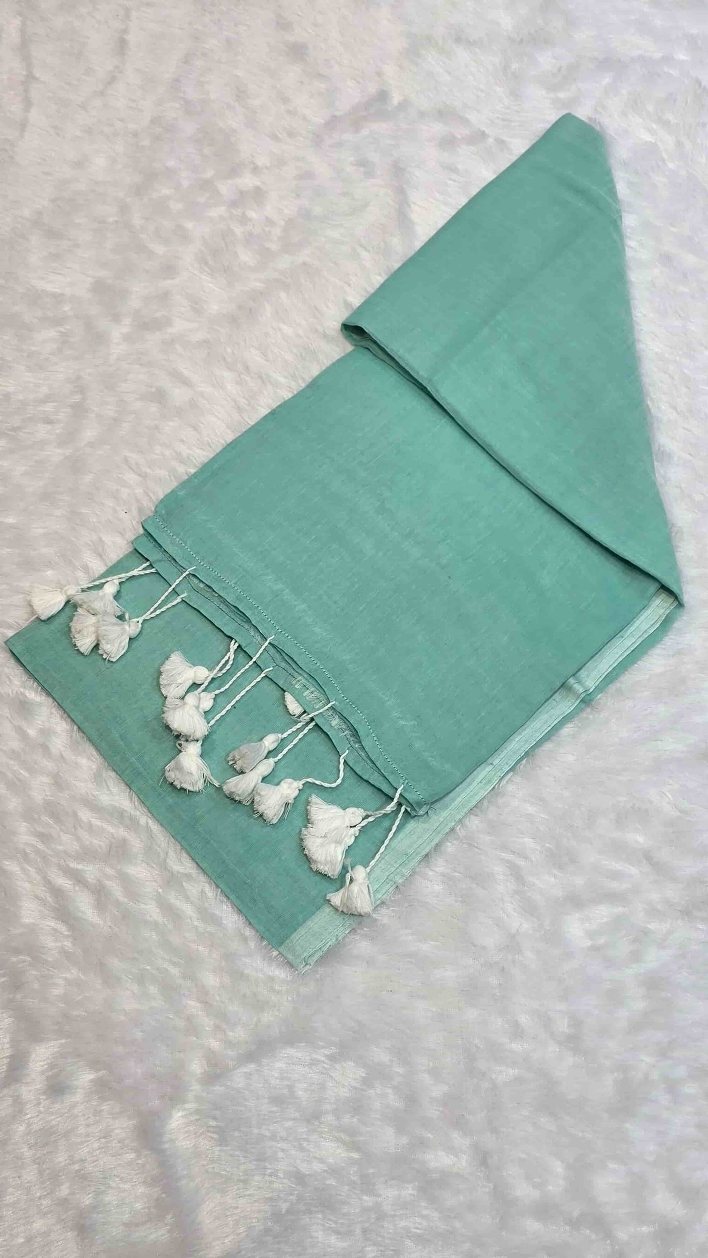 Soft mulmul cotton saree in sea green with handcrafted tassels