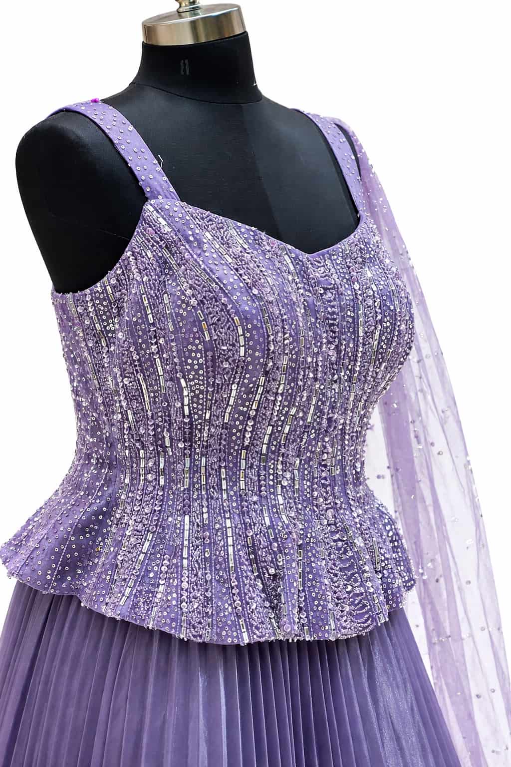 Lilac designer gown with pleated skirt and net dupatta