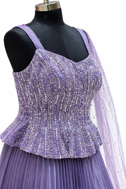Lilac designer gown with pleated skirt and net dupatta