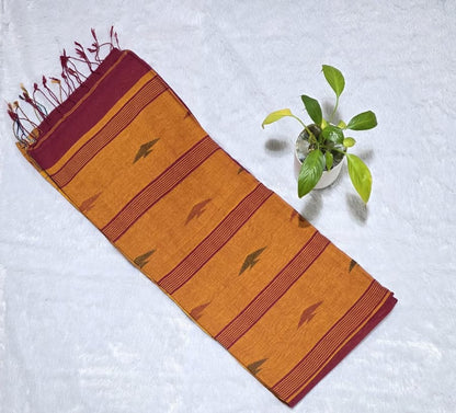 Traditional maroon pure cotton saree with triangle butties, Ikat border pattern and tassel pallu