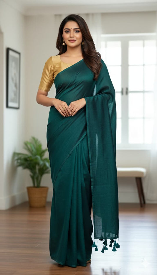 Dark teal green mulmul cotton saree with hand-tied tassels on pallu