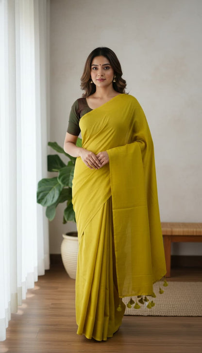 Mustard yellow mulmul cotton saree with hand-tied tassels on edge