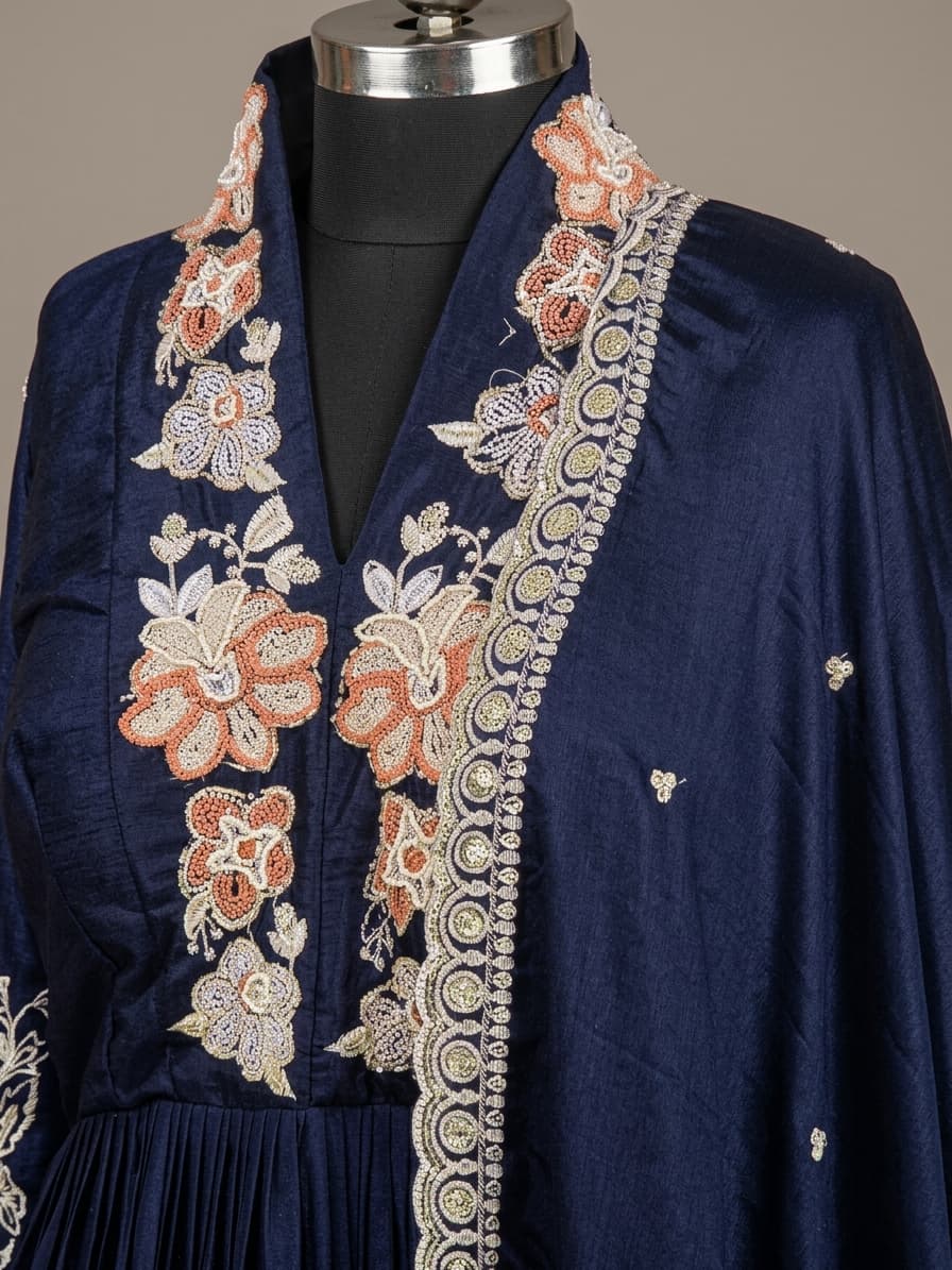 Traditional navy blue Anarkali gown with floral embroidery and dupatta