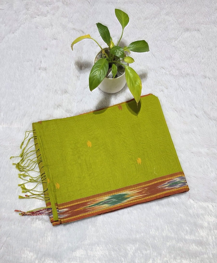 Parrot green cotton saree with delicate triangle motifs, Ikat weaving border and matching contrast blouse piece