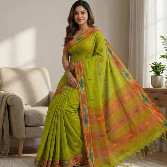 Pure cotton parrot green saree featuring triangle butti design, woven Ikat border and contrast pallu with tassels