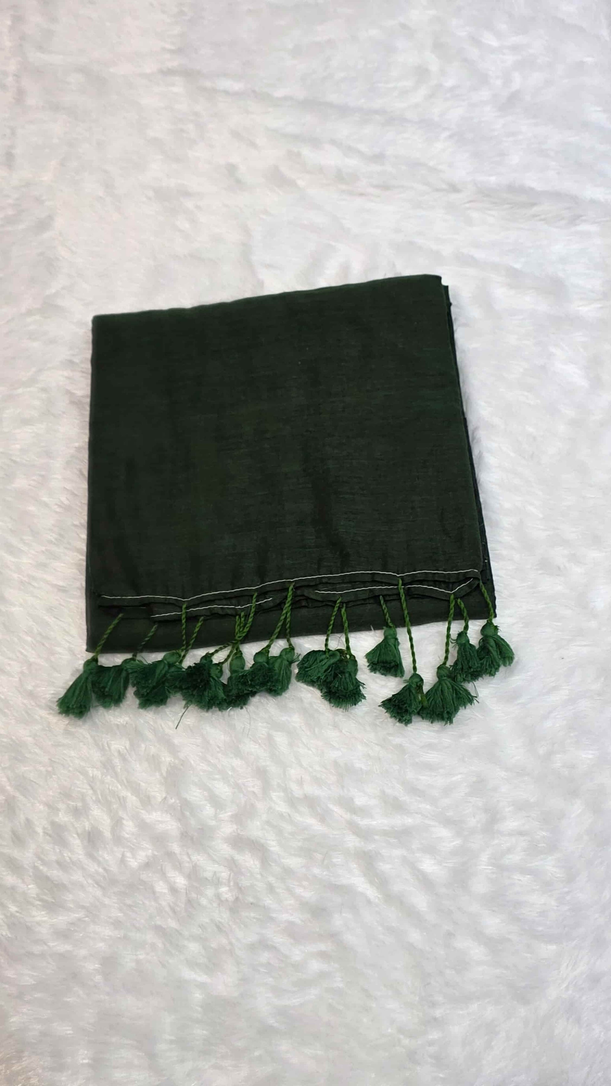 Soft mulmul cotton saree in bottle green with handcrafted tassels