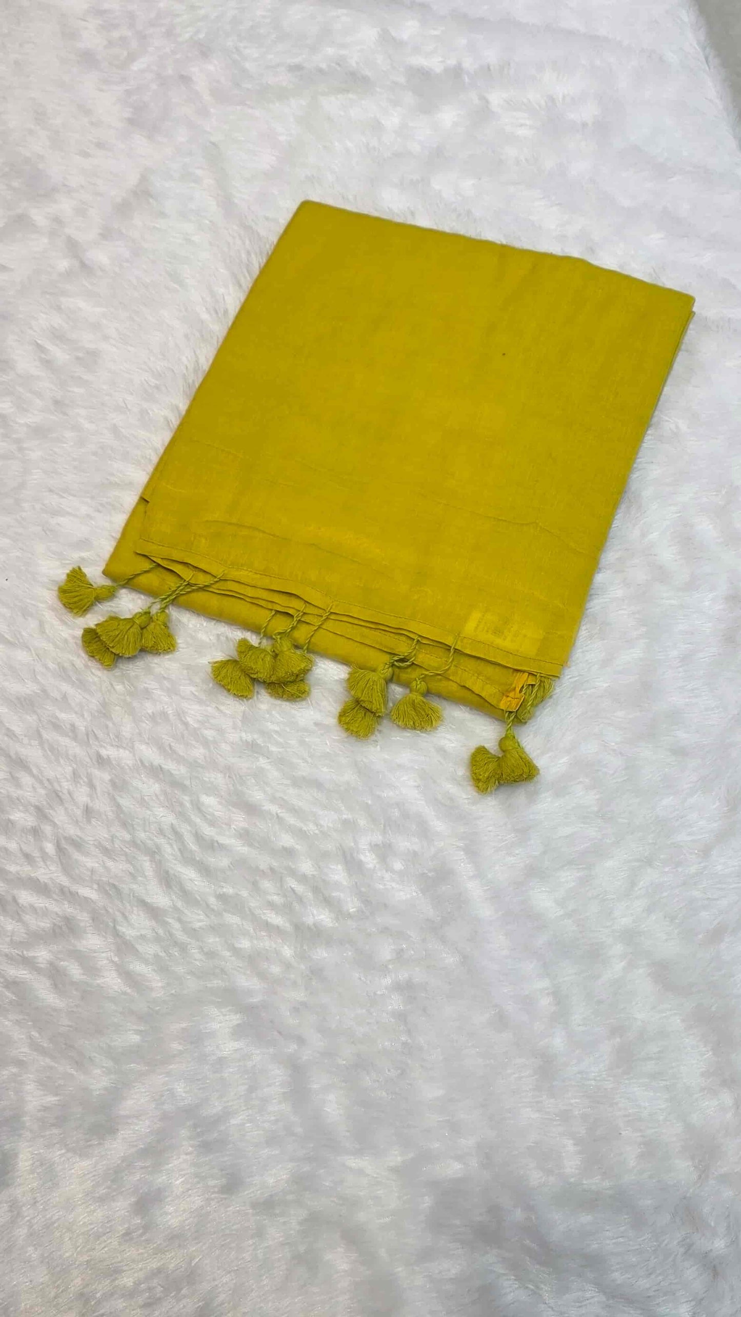 Plain mustard yellow mulmul cotton saree with tassel pallu