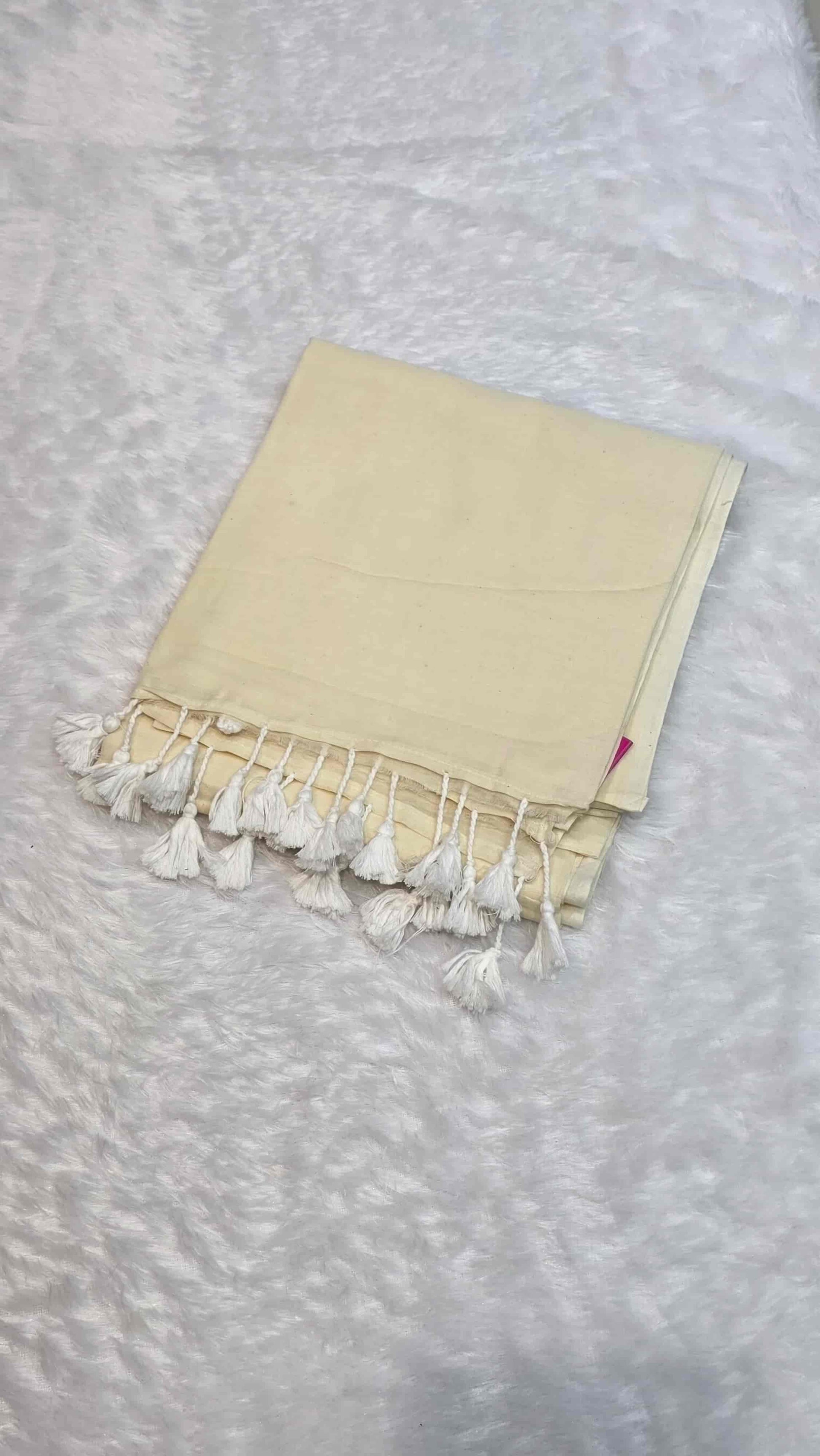 Soft mulmul cotton saree in off white with handcrafted white tassels