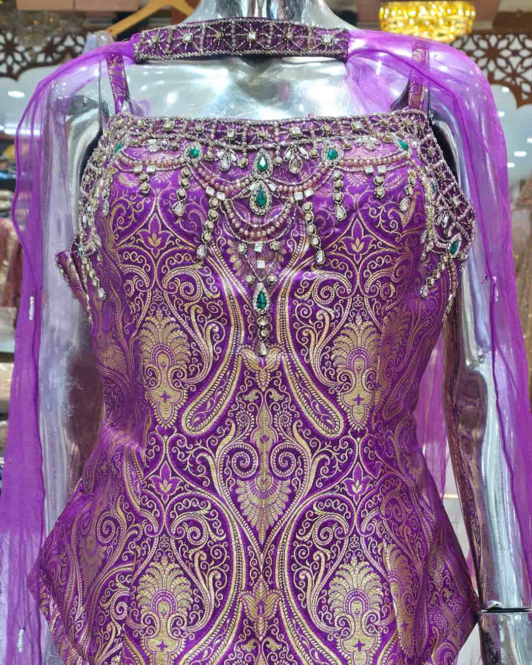 Heavy embroidered neckline detail on royal purple Banarasi peplum top