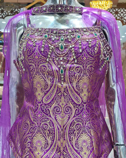Heavy embroidered neckline detail on royal purple Banarasi peplum top