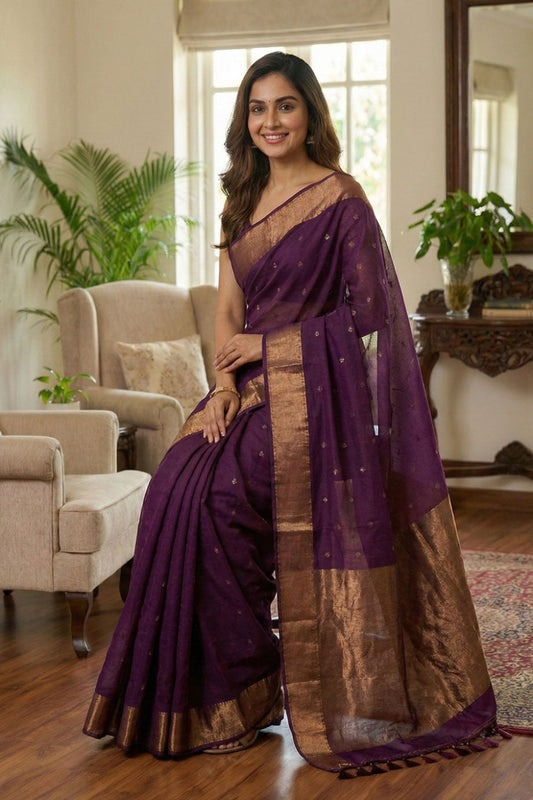 Purple pure cotton saree with all over butties, copper zari pallu and simple golden border with tussels by Kabra the Fashionista