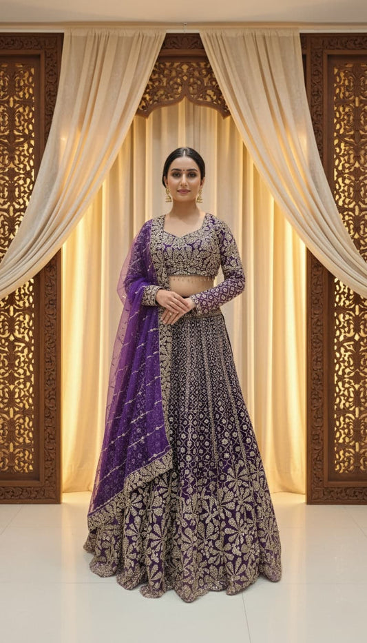 Shop this royal purple embroidered lehenga set featuring heavy sequin and thread work, sweetheart neckline blouse, flared silhouette, and net dupatta — perfect for weddings, receptions, and festive occasions.