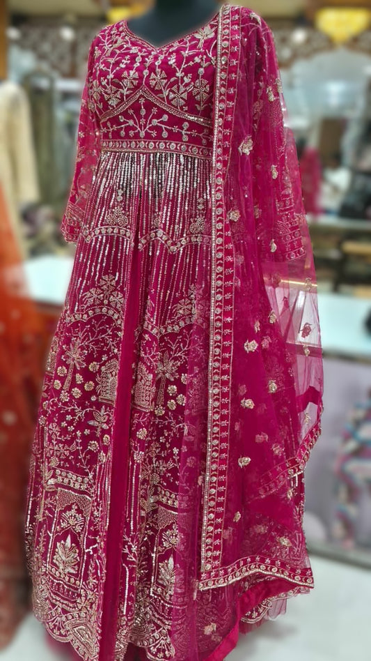 Close-up of heavy sequin and bead embroidery on rani pink Anarkali gown