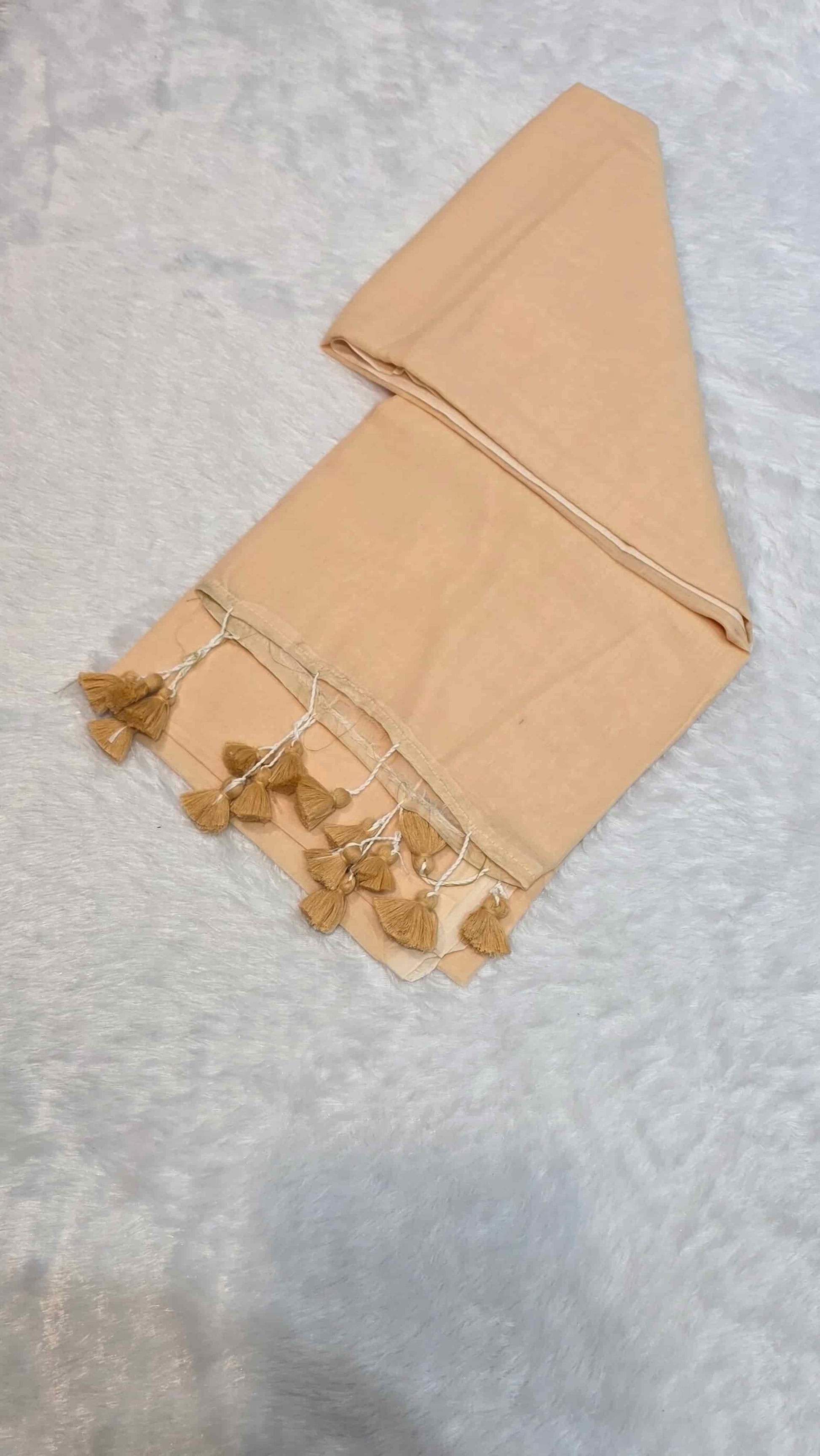 Elegant cream mulmul cotton saree with hand-tied tassels