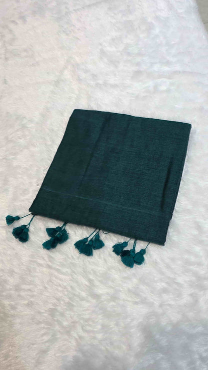 Soft mulmul cotton saree in dark teal green with tassel pallu