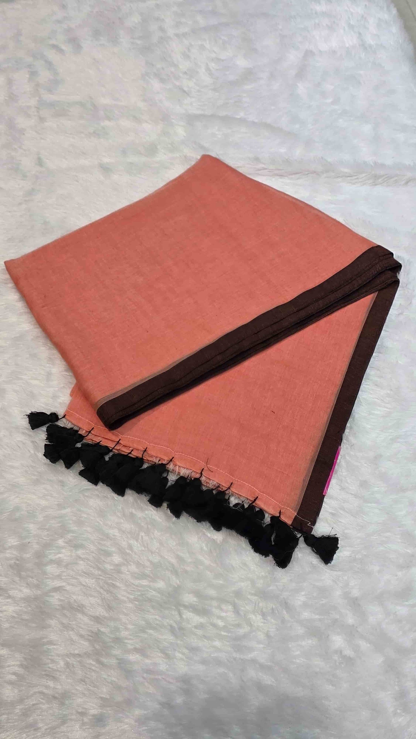 Soft mulmul cotton saree in dusty peach with solid black border