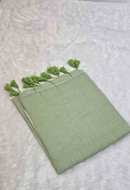 Light green cotton saree for casual and festive wear with tassels