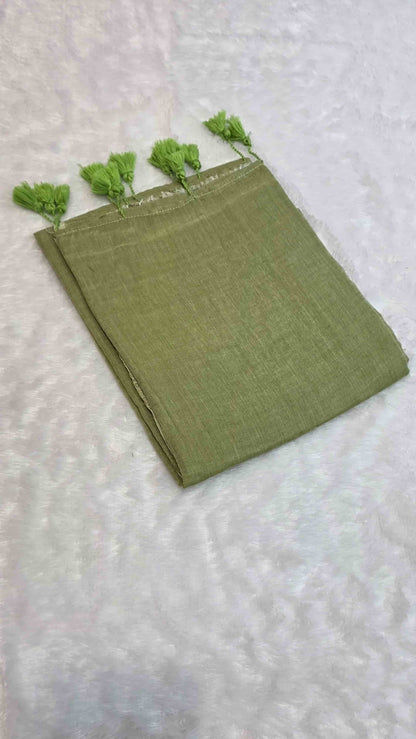 Lightweight olive green mulmul cotton saree with handcrafted tassels