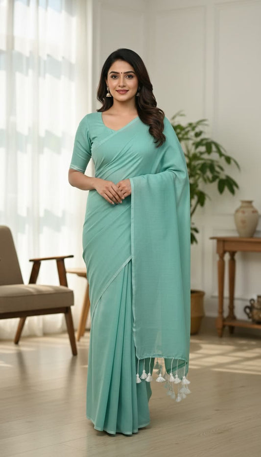 Plain sea green mulmul cotton saree with tassel edge