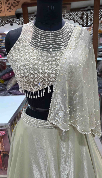 Close view of pearl embroidered blouse with layered neckline detailing in Indo-Western lehenga set