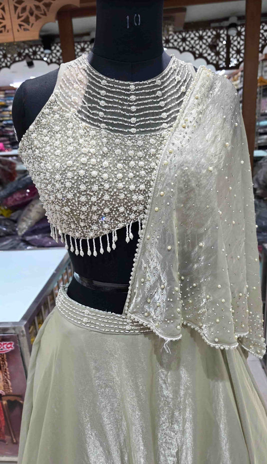 Close view of pearl embroidered blouse with layered neckline detailing in Indo-Western lehenga set