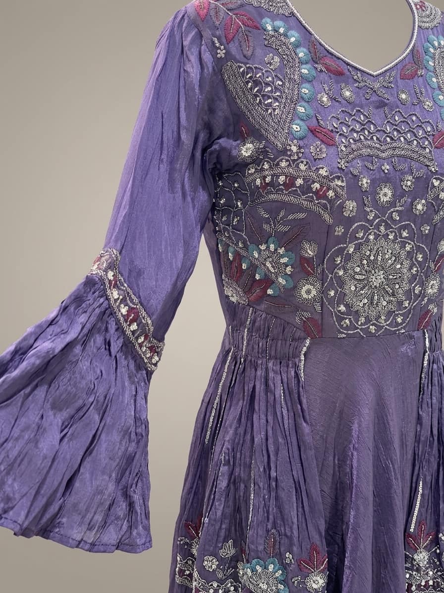 Elegant purple ethnic gown with heavy embroidered top and soft flare