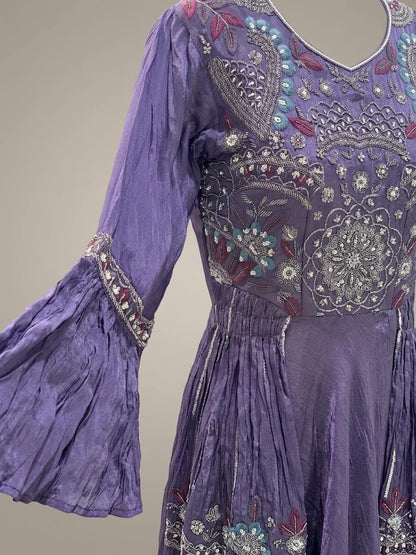 Elegant purple ethnic gown with heavy embroidered top and soft flare