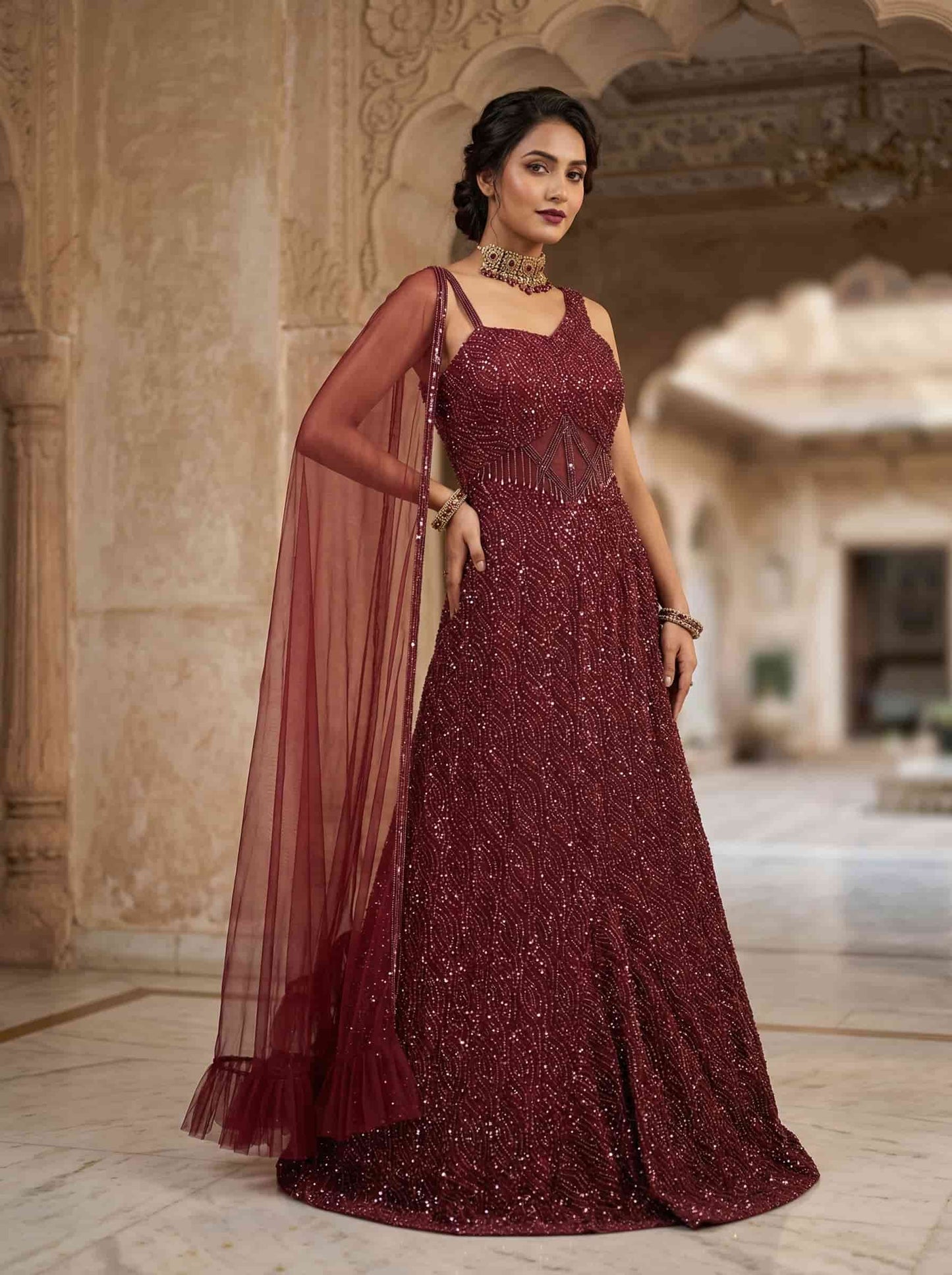 Designer red cocktail gown with all-over sequins and flared silhouette
