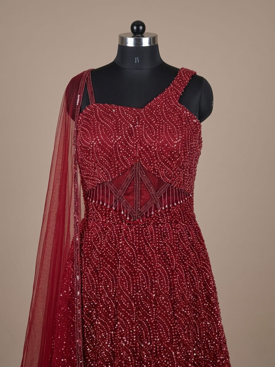 Wine red sequin embellished gown with corset bodice and net dupatta